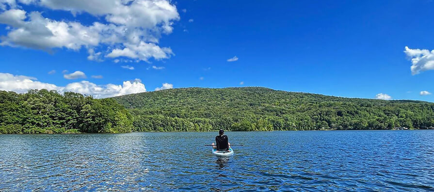 Woman on kayak in open water