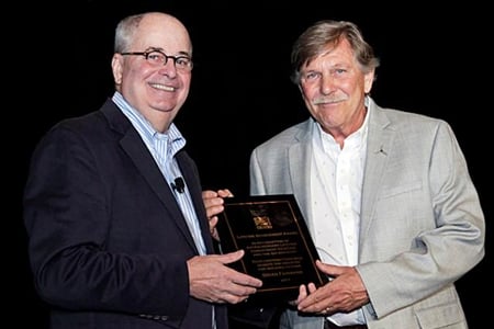 In 2017, Brian (right) received the Lifetime Achievement Award from NSAA. Michael Berry (left), the former President of NSAA, presents. Picture c/o Jiminy Peak.