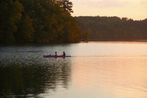 Canoeing on Berkshire lake, sunset, summertime
