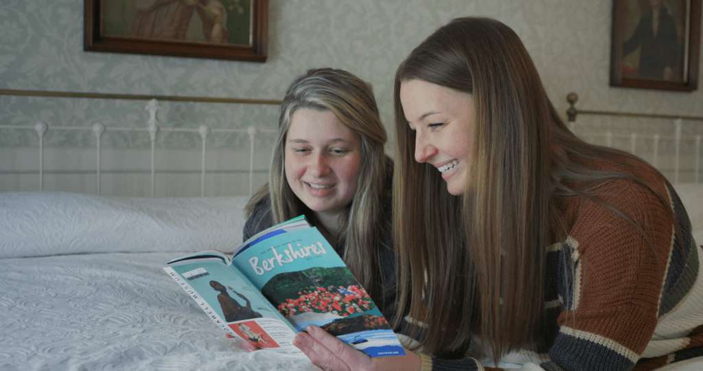 Two women reading the Official Guide to the Berkshires at the Red Lion Inn. Photo by Great Sky Media.