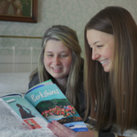 Two women reading the Official Guide to the Berkshires at the Red Lion Inn. Photo by Great Sky Media.