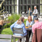 Groups of people eating outdoors at The Barn Kitchen and Bar in Williamstown, MA