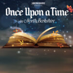 A children's book open wide with sparkles all around entitled Once Upon a Time