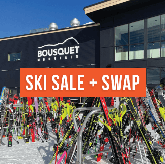 Racks of skiis outside Bousquet