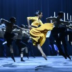 Ballet Dancers leap on stage