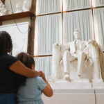 A mother and daughter gaze at the Lincoln statue at Chesterwood Museum.