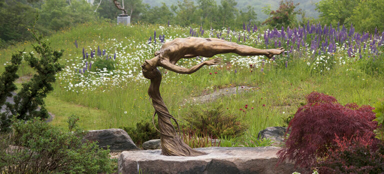 Andrew DeVries, Lenox, Fine Art, Innocence, hi res, Spring, bronze, retail, shopping, gallery, culture 895×400 The sculpture Innocence is on display in the middle of a wildflower field.