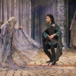 A scene from MacBeth featuring two costumed characters on stage