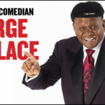 Comedian George Wallace smiles as he looks to his audience