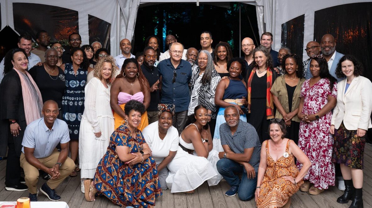 A diverse group of people participate in round table discussion