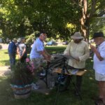 Artists painting outdoors at the Lenox Library
