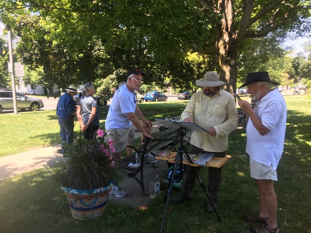 Artists painting outdoors at the Lenox Library
