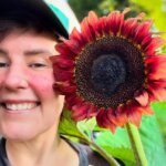 Britta A close up shot of Britta and a sunflower