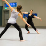 Two actors practice stage movement