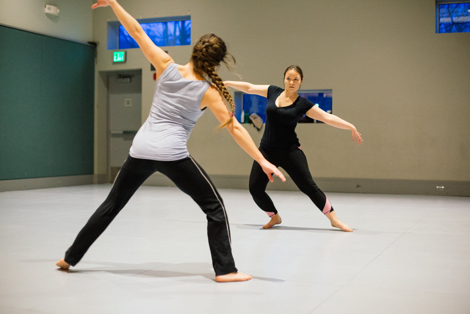 Two actors practice stage movement
