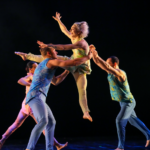 Dancers in colorful outfits grace the Mahaiwe stage