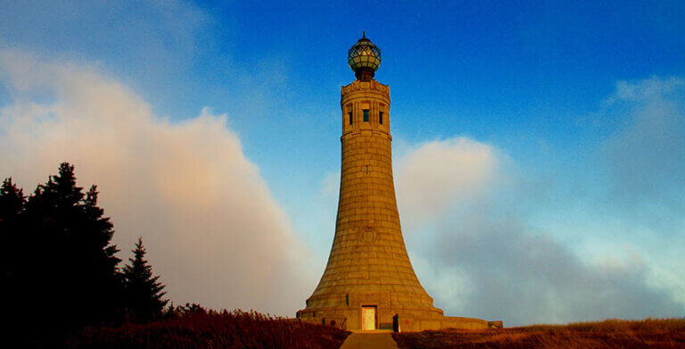 Mt. Greylock Summit photo credit kara thornton 895×450 Mt Greylock Summit monument stands tall during sunset with blue sky and clouds around it