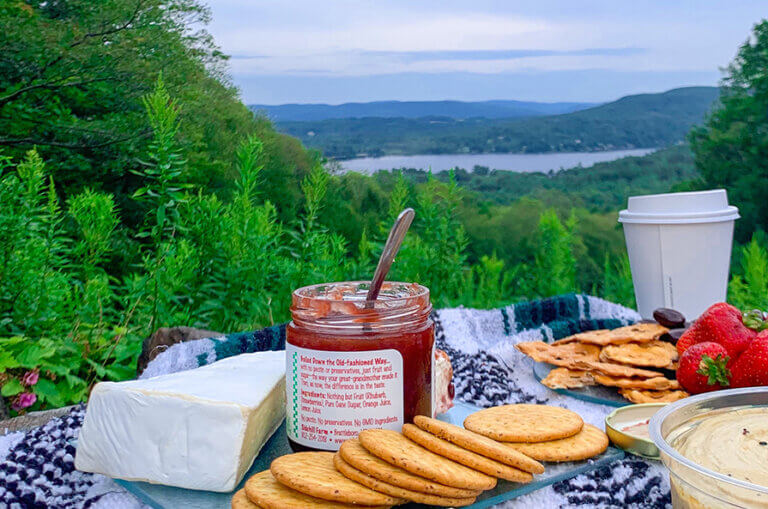 Picnic, Summer, Scenic, Olivia’s Overlook, West Stockbridge, Taste The Berkshires, PC Abby Leadbetter 895×590 A picnic spread is laid out on a blanket overlooking a beautiful Berkshire landscape.