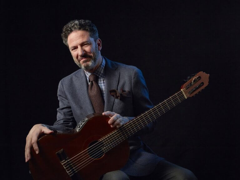 John Pizzarelli poses with his guitar