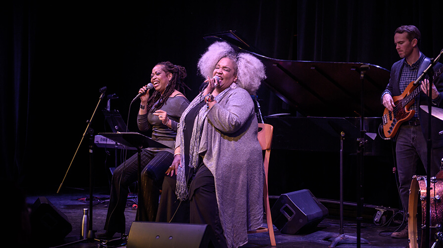 Wanda Houston stands center stage singing at Berkshires Jazz showcase
